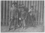 Lewis Hine child labor: A group working on night shift at Hereford Glass Works, Cape May Court House, N.J. November 19, 1909. I saw the smalles[t] boy carrying in shortly before midnight, November 18th. Location: Cape May Court House, New Jersey.