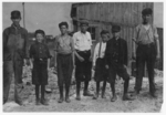 Lewis Hine child labor: A few of the young boys working on the night shift at the Alexandria (Va.) Glass Factory. See also photos and labels 2260 to 2271. Location: Alexandria, Virginia.