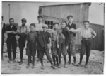 Lewis Hine child labor: A few of the young boys working on the night shift at the Alexandria (Va.) Glass Factory. See also photos and labels 2260 to 2271. Location: Alexandria, Virginia.