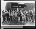 Lewis Hine child labor: A glass works in Indiana, Night Shift Going to Work. 5 P.M. (See also #115). Location: Indiana.
